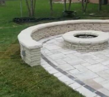Backyard patio with gas fire pit and a half-moon sitting wall Arlington Heights