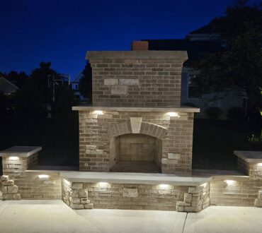 Masonry brick fireplace with wall and columns Low voltage lighting Winfield