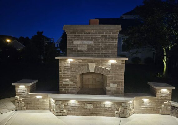 Masonry brick fireplace with wall and columns Low voltage lighting Winfield